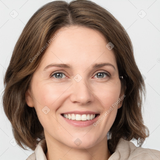 Joyful white young-adult female with medium  brown hair and green eyes