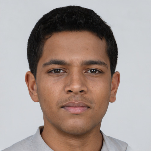 Neutral latino young-adult male with short  brown hair and brown eyes