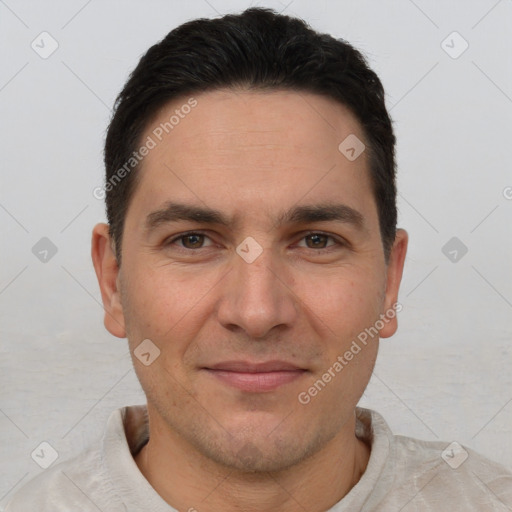 Joyful white adult male with short  brown hair and brown eyes