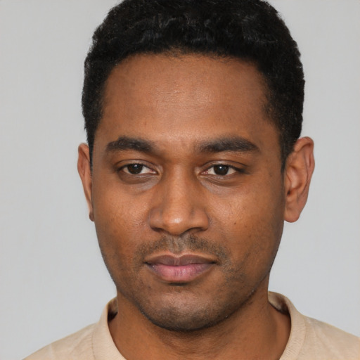 Neutral black young-adult male with short  black hair and brown eyes