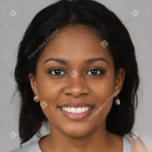 Joyful black young-adult female with medium  black hair and brown eyes