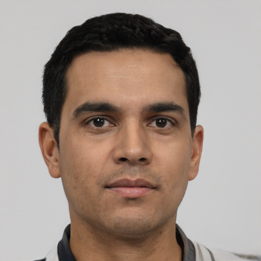 Neutral latino young-adult male with short  black hair and brown eyes
