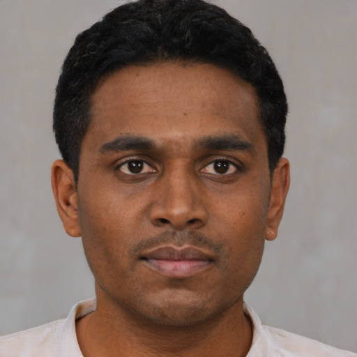 Neutral black young-adult male with short  black hair and brown eyes