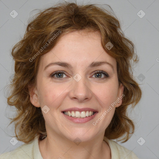 Joyful white young-adult female with medium  brown hair and blue eyes