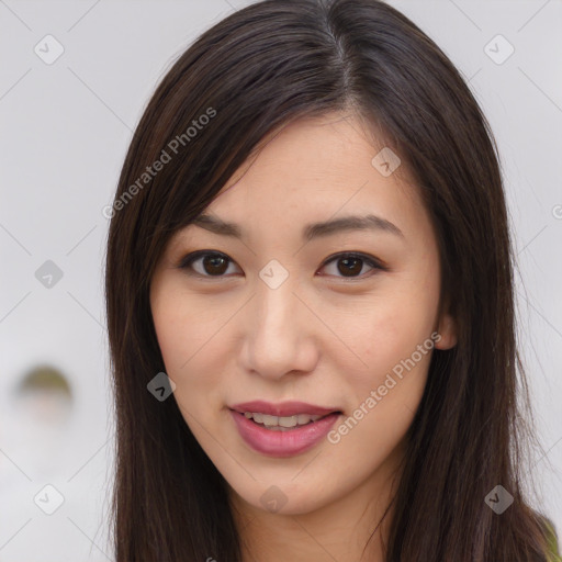 Joyful asian young-adult female with long  brown hair and brown eyes