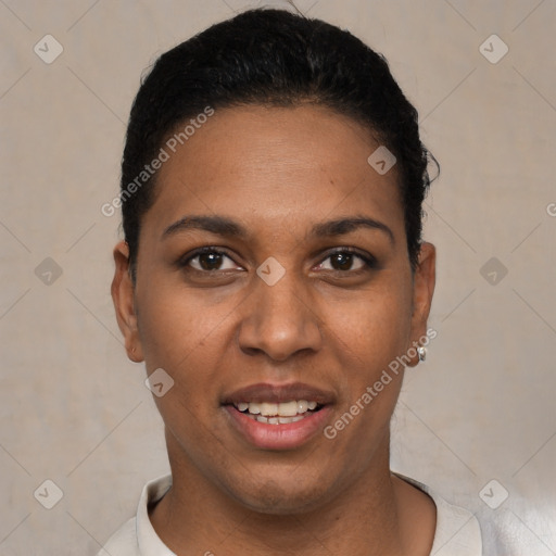 Joyful black young-adult female with short  black hair and brown eyes
