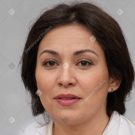 Joyful white adult female with medium  brown hair and brown eyes