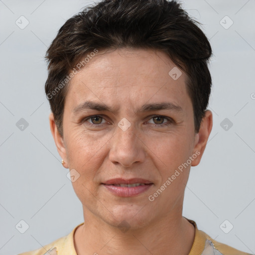 Joyful white adult female with short  brown hair and brown eyes