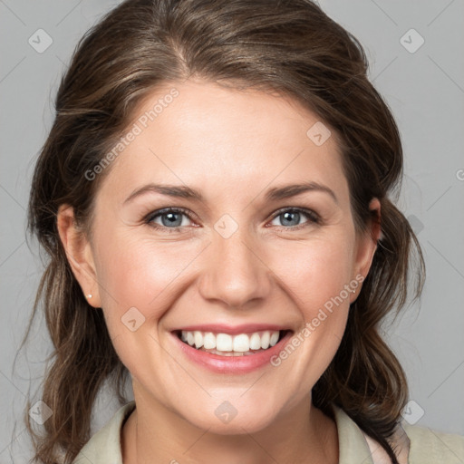 Joyful white young-adult female with medium  brown hair and grey eyes