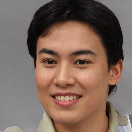 Joyful asian young-adult female with medium  brown hair and brown eyes