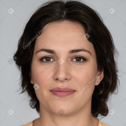 Joyful white adult female with medium  brown hair and brown eyes