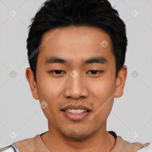 Joyful asian young-adult male with short  black hair and brown eyes