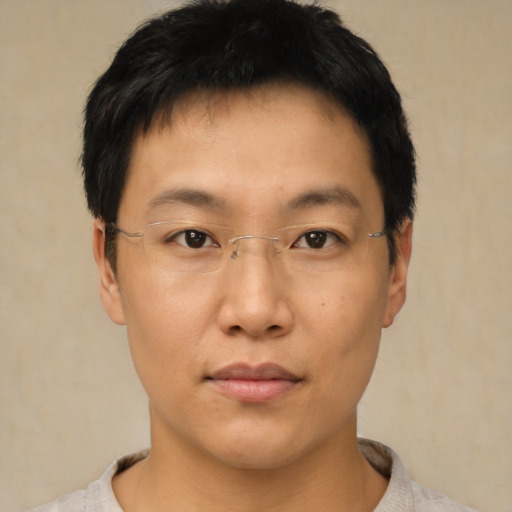Neutral asian young-adult male with short  brown hair and brown eyes