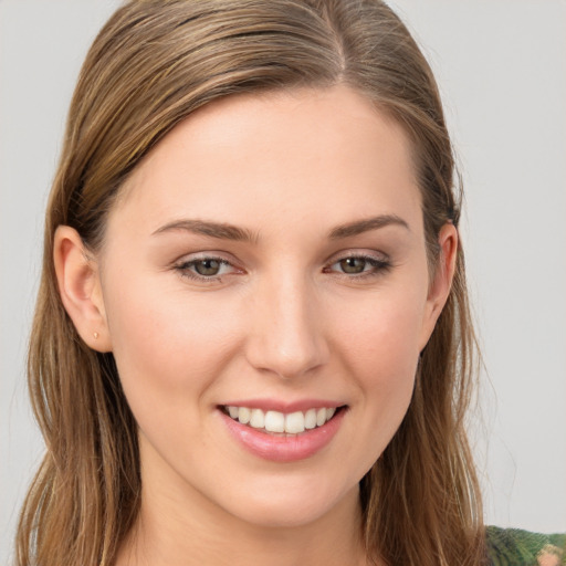 Joyful white young-adult female with long  brown hair and grey eyes