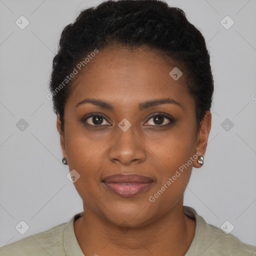 Joyful black young-adult female with short  black hair and brown eyes