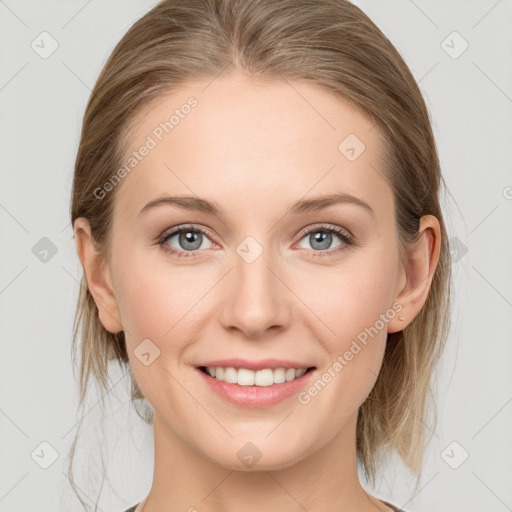 Joyful white young-adult female with medium  brown hair and blue eyes