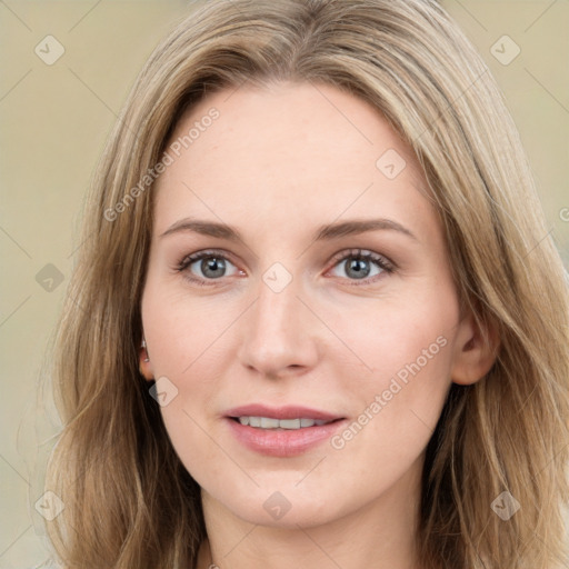 Joyful white young-adult female with long  brown hair and green eyes