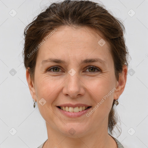 Joyful white adult female with short  brown hair and brown eyes