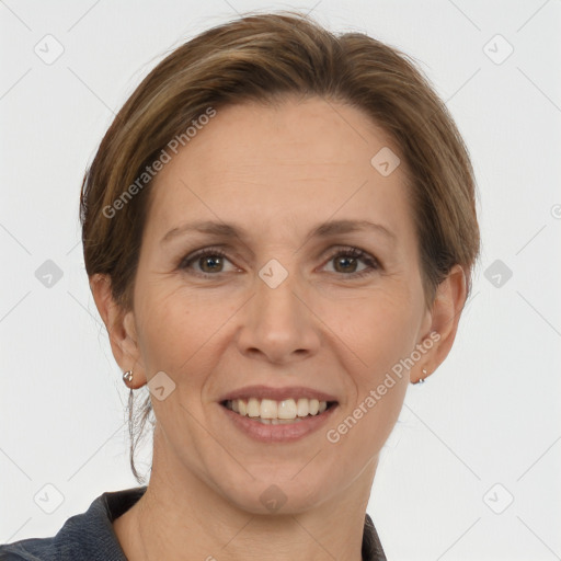 Joyful white adult female with short  brown hair and grey eyes