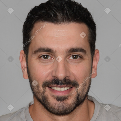 Joyful white young-adult male with short  black hair and brown eyes