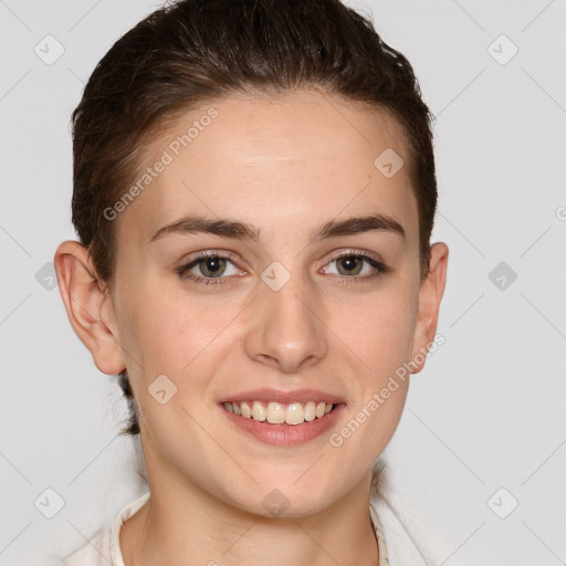 Joyful white young-adult female with medium  brown hair and grey eyes