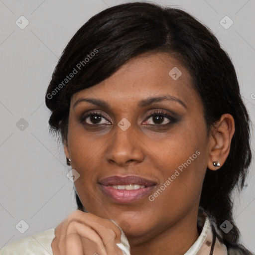 Joyful latino adult female with medium  black hair and brown eyes