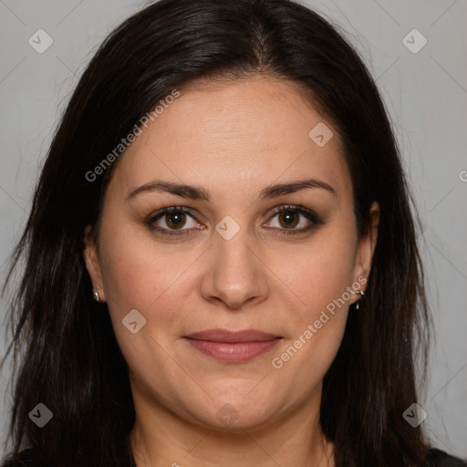 Joyful white adult female with long  brown hair and brown eyes