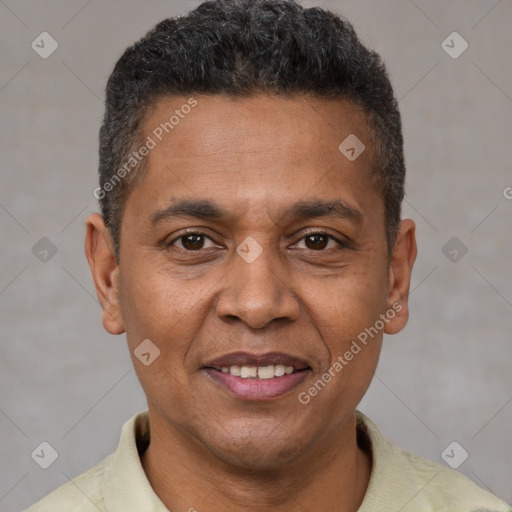 Joyful black adult male with short  brown hair and brown eyes