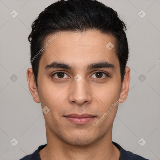 Joyful white young-adult male with short  black hair and brown eyes