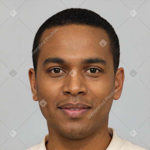 Joyful black young-adult male with short  black hair and brown eyes