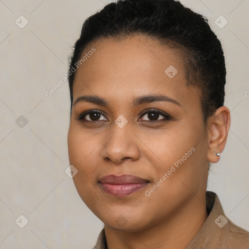 Joyful black young-adult female with short  brown hair and brown eyes