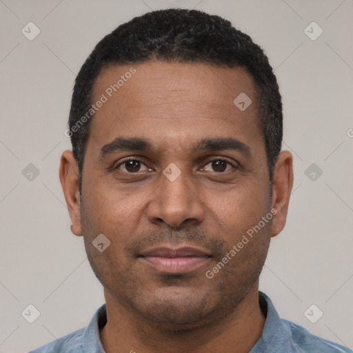 Joyful latino adult male with short  black hair and brown eyes