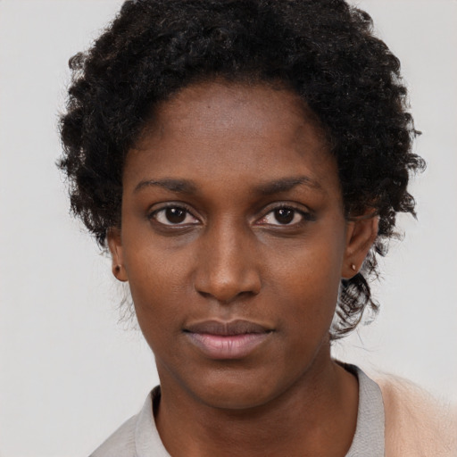 Neutral black young-adult female with short  brown hair and brown eyes