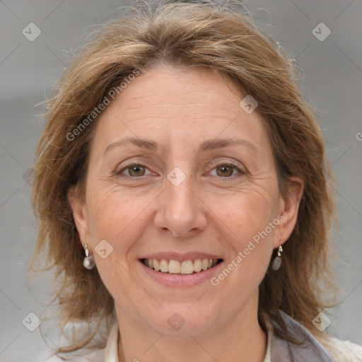 Joyful white adult female with medium  brown hair and grey eyes