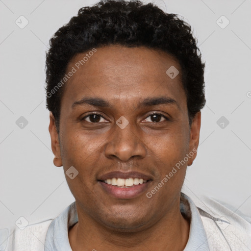 Joyful black young-adult male with short  brown hair and brown eyes