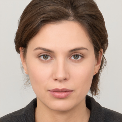 Neutral white young-adult female with medium  brown hair and brown eyes