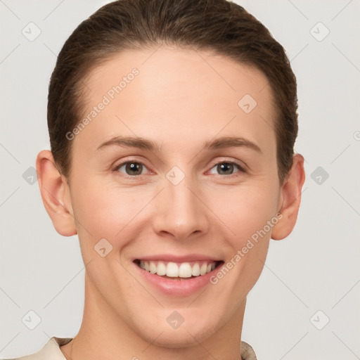 Joyful white young-adult female with short  brown hair and grey eyes