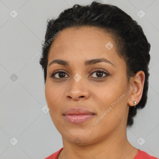 Joyful black young-adult female with short  brown hair and brown eyes