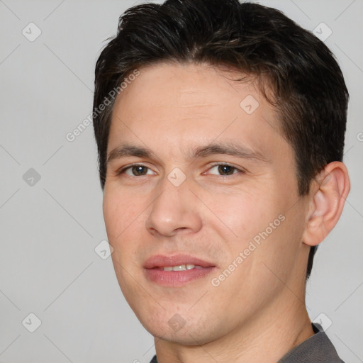 Joyful white adult male with short  brown hair and brown eyes