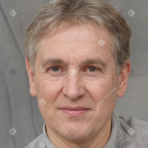 Joyful white middle-aged male with short  brown hair and brown eyes