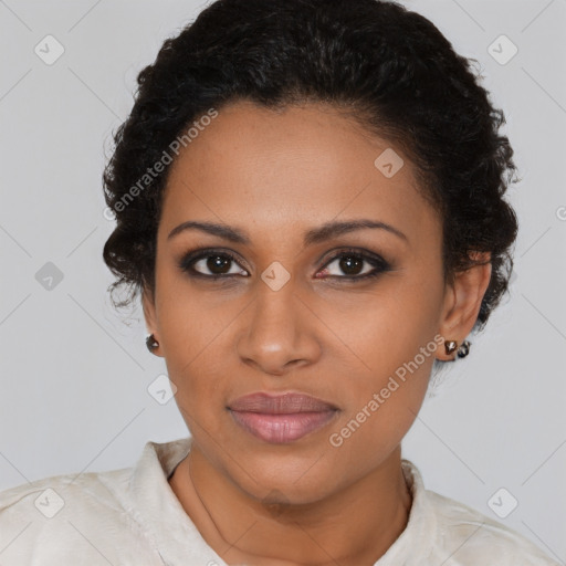 Joyful black young-adult female with short  brown hair and brown eyes