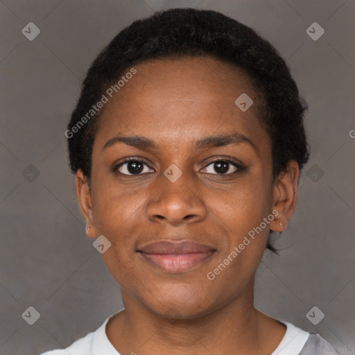 Joyful black young-adult female with short  brown hair and brown eyes