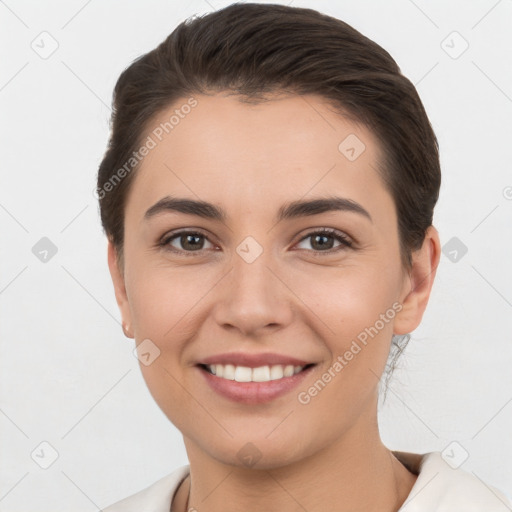 Joyful white young-adult female with short  brown hair and brown eyes