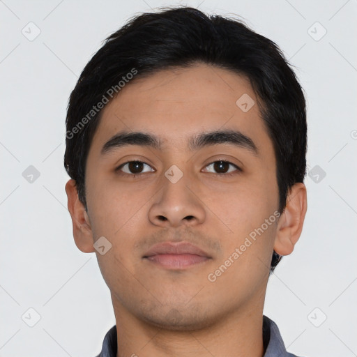 Neutral latino young-adult male with short  black hair and brown eyes