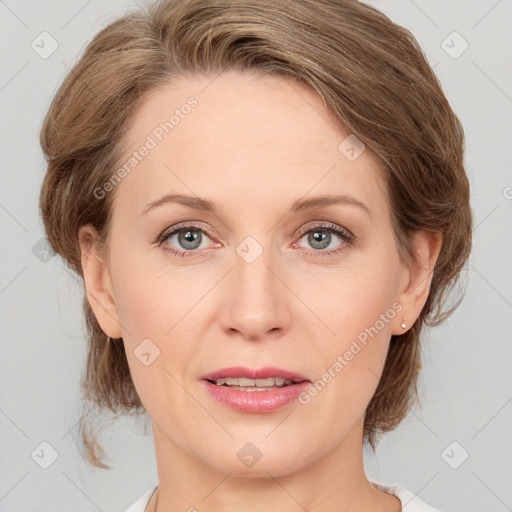 Joyful white adult female with medium  brown hair and grey eyes