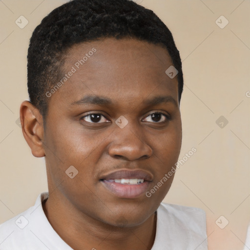 Joyful black young-adult male with short  brown hair and brown eyes