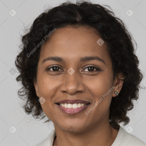 Joyful black young-adult female with medium  brown hair and brown eyes