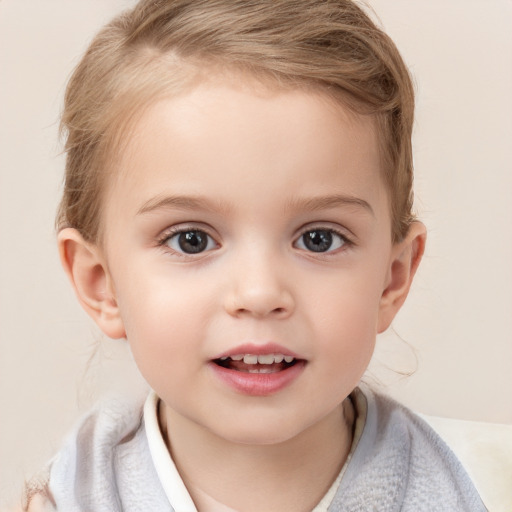 Joyful white child female with short  brown hair and blue eyes