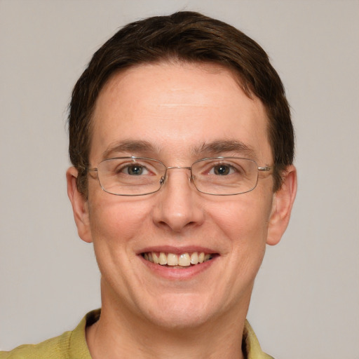 Joyful white adult male with short  brown hair and grey eyes