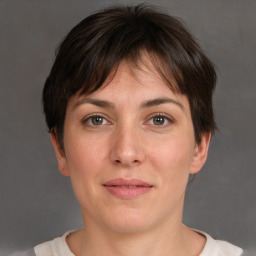 Joyful white adult female with short  brown hair and brown eyes